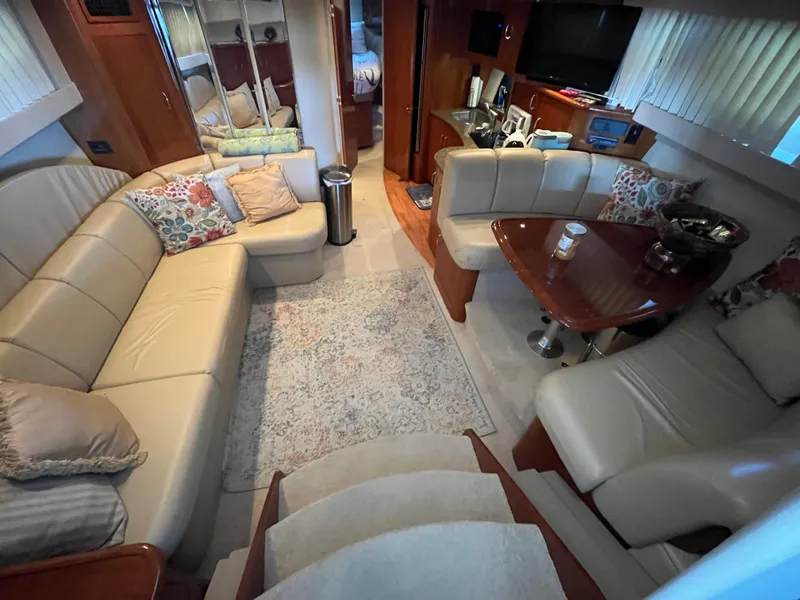 Slide: The Image of Luxurious interior of 2005 Carver 36 Mariner yacht with plush seating and elegant decor. - 10
