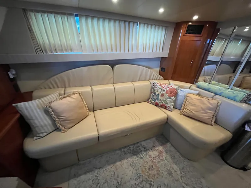 Slide: The Image of Interior of 2005 Carver 36 Mariner yacht with beige sofa and decorative pillows. - 12