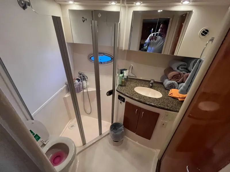 Slide: The Image of Bathroom interior of 2005 Carver 36 Mariner yacht, featuring shower and vanity. - 14