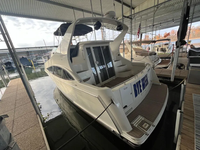 Slide: The Image of 2005 Carver 36 Mariner docked in a covered marina. - 5