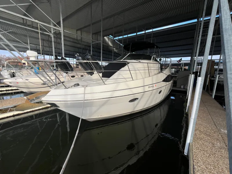 Slide: The Image of 2005 Carver 36 Mariner docked in a covered marina. - 6