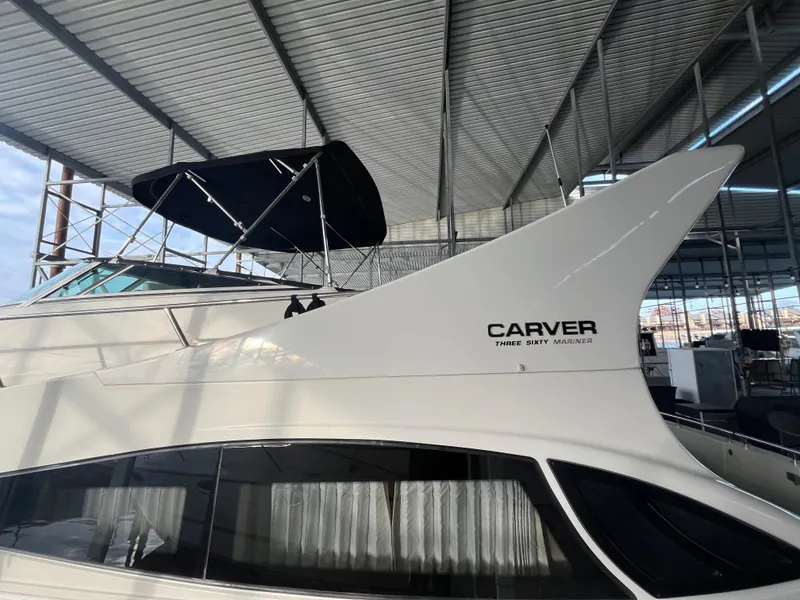Slide: The Image of 2005 Carver 36 Mariner yacht under covered dock, side view. - 7