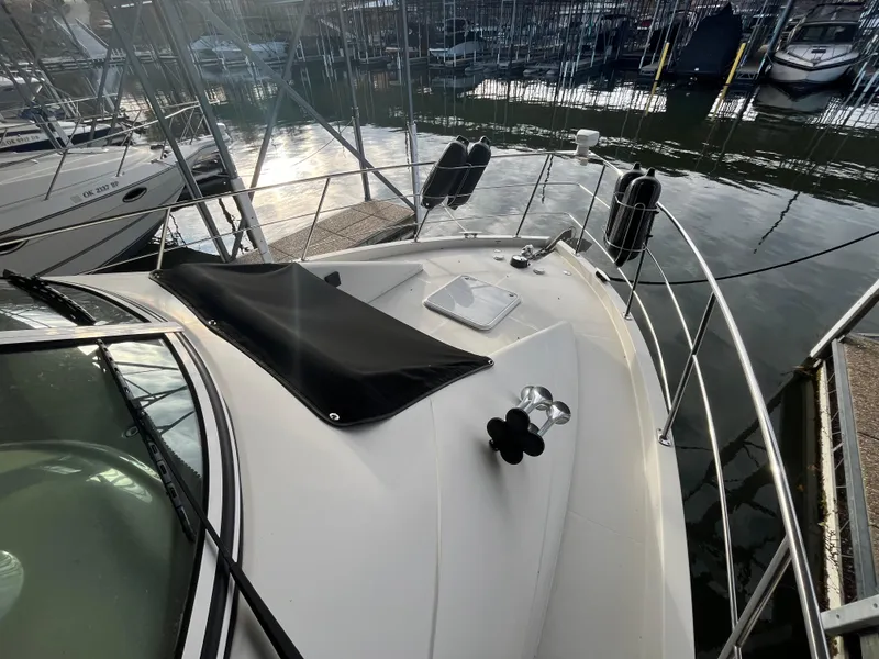 Slide: The Image of 2005 Carver 36 Mariner yacht docked at marina, sunlit deck view. - 8