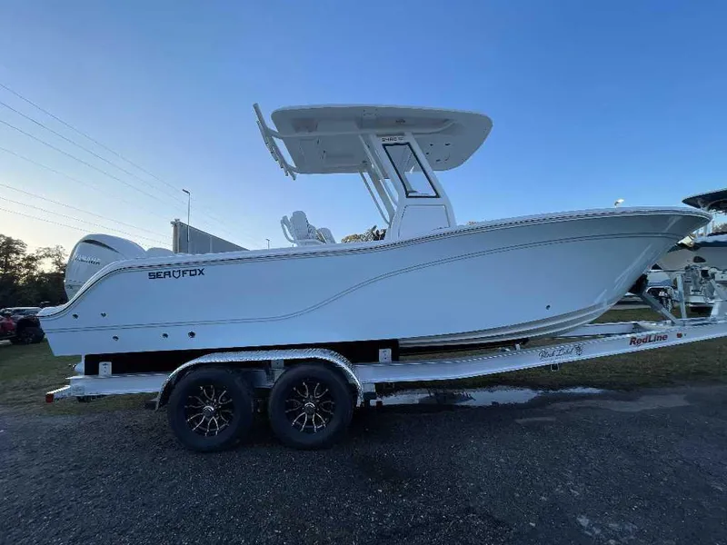Slide: The Image of 2025 Sea Fox 248 Commander boat on trailer, side view at sunset. - 3