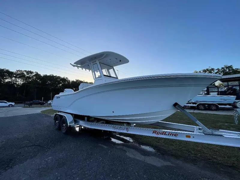 Slide: The Image of 2025 Sea Fox 248 Commander boat on trailer, parked outdoors. - 4