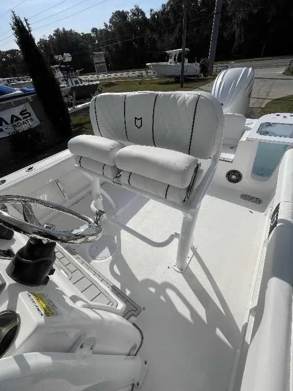 Slide: The Image of 2025 Sea Fox 248 Commander boat interior with steering wheel and seating. - 7