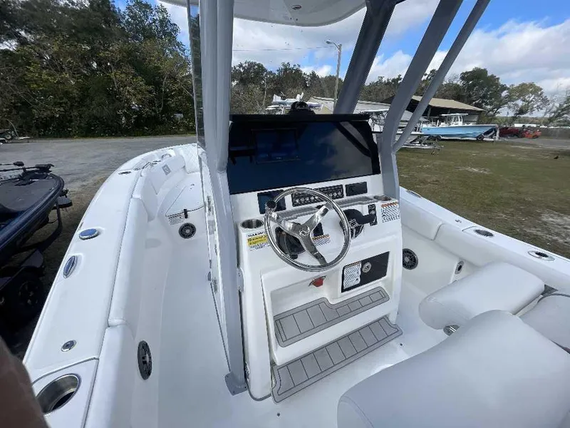 Slide: The Image of 2025 Sea Fox 248 Commander boat interior with steering console and seating. - 1