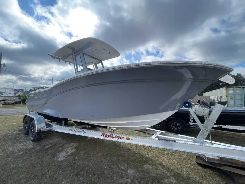 Slide: The Image of 2025 Sea Fox 248 Commander boat on trailer under cloudy sky. - 10