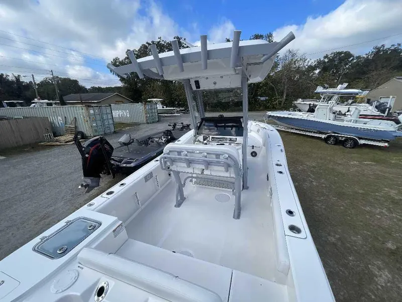 Slide: The Image of 2025 Sea Fox 248 Commander boat, white interior, outdoor setting, clear sky. - 6
