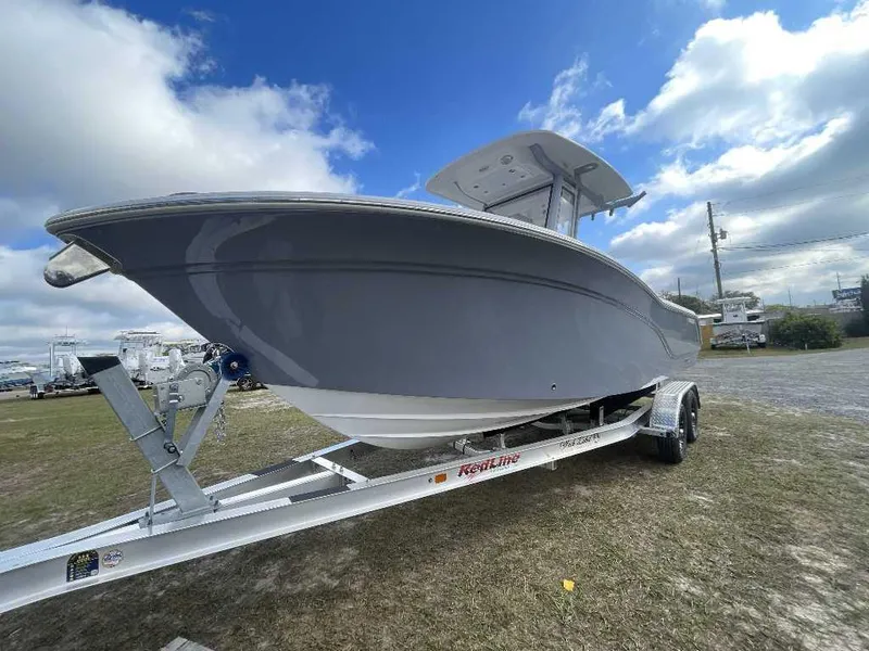 Slide: The Image of 2025 Sea Fox 248 Commander boat on trailer under a blue sky. - 9