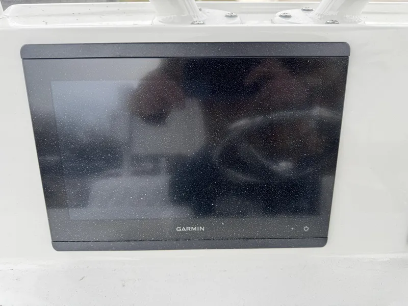 Slide: The Image of Garmin display on 2025 Shallow Sport 24 Modified V boat dashboard. - 14