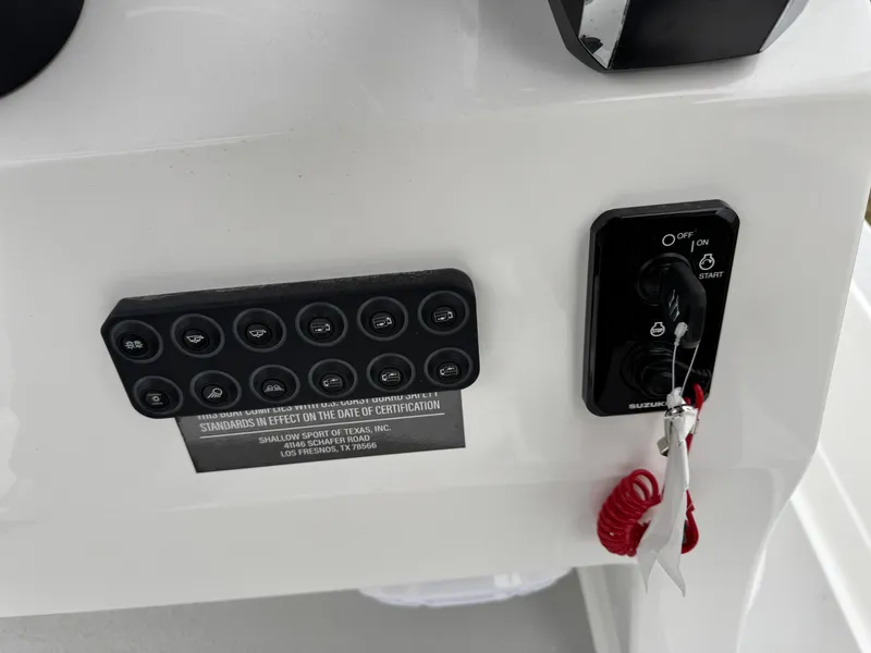 Slide: The Image of Control panel of 2025 Shallow Sport 24 Modified V boat with ignition switch and buttons. - 17