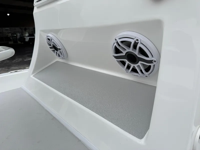 Slide: The Image of 2025 Shallow Sport 24 Modified V boat speakers, white interior detail. - 22