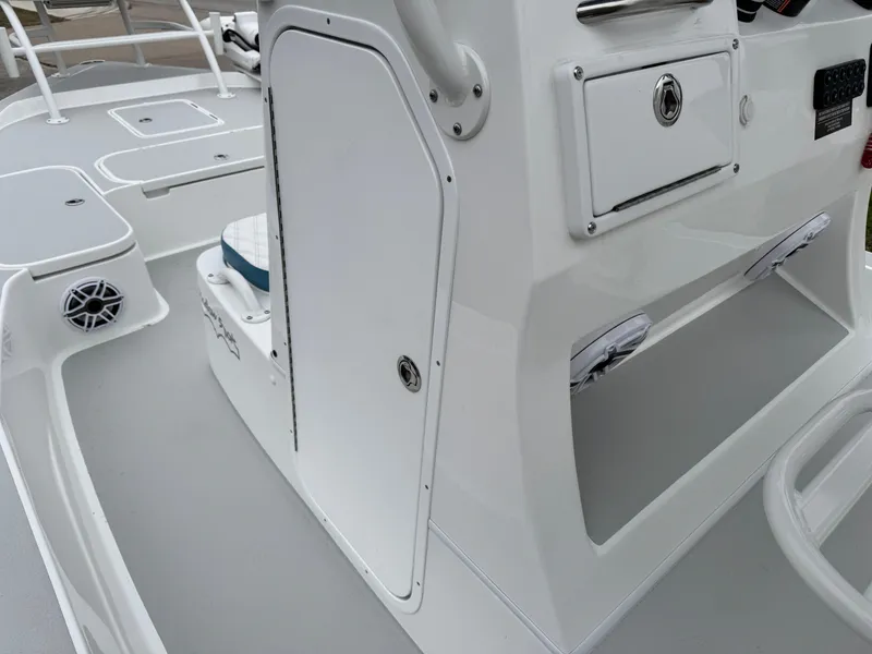 Slide: The Image of 2025 Shallow Sport 24 Modified V boat interior with storage compartments and sleek design. - 23