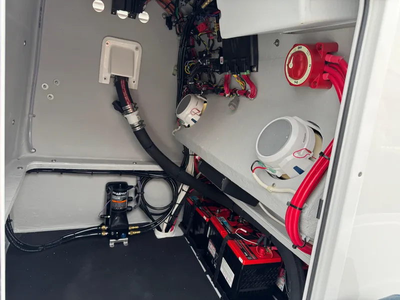 Slide: The Image of Interior view of 2025 Shallow Sport 24 Modified V boat showing wiring and components. - 24