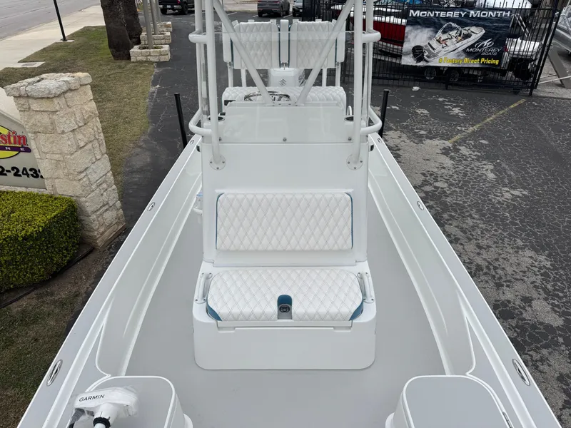 Slide: The Image of 2025 Shallow Sport 24 Modified V boat with white seating and center console. - 27