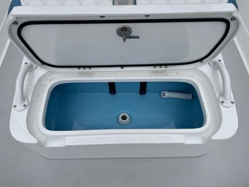 Slide: The Image of Open storage compartment on 2025 Shallow Sport 24 Modified V boat. - 28