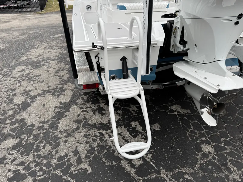 Slide: The Image of 2025 Shallow Sport 24 Modified V boat with rear ladder and motor detail. - 3