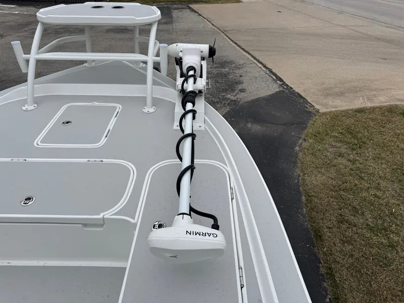 Slide: The Image of 2025 Shallow Sport 24 Modified V boat with Garmin trolling motor on deck. - 36