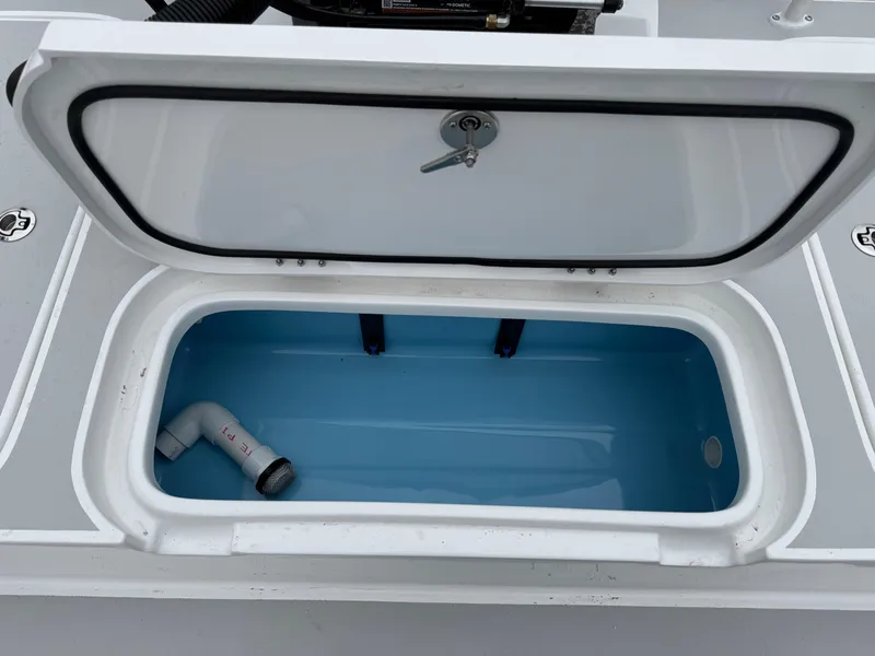 Slide: The Image of Open storage compartment on 2025 Shallow Sport 24 Modified V boat. - 41