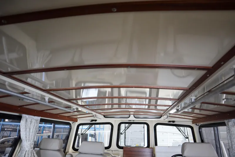 Slide: The Image of Interior view of 2025 Hewescraft 290 Adventure ET HT boat, featuring elegant ceiling design. - 15