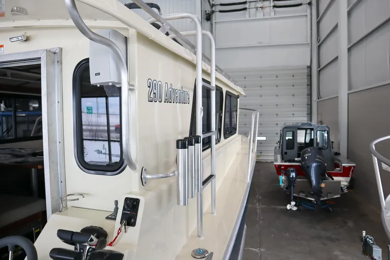 Slide: The Image of 2025 Hewescraft 290 Adventure ET HT boat in a storage facility. - 23