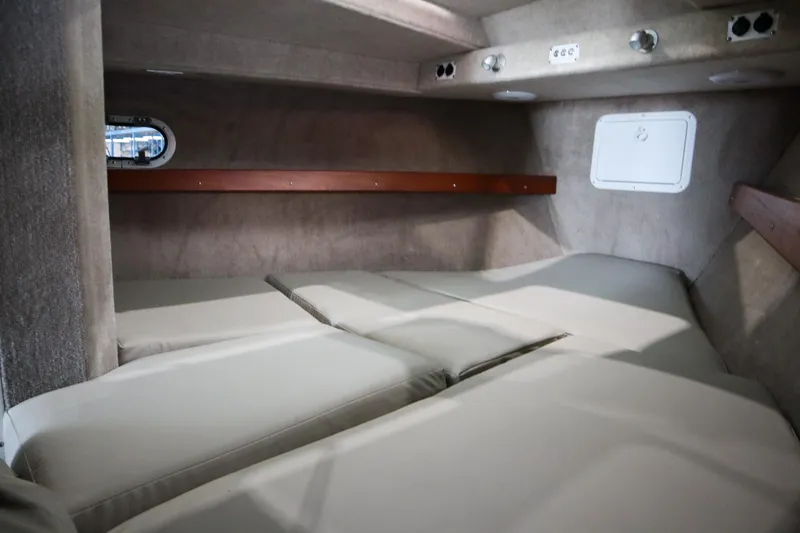 Slide: The Image of 2025 Hewescraft 290 Adventure ET HT cabin interior with cushioned sleeping area. - 34