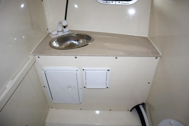 Slide: The Image of 2025 Hewescraft 290 Adventure ET HT interior sink and storage area. - 35