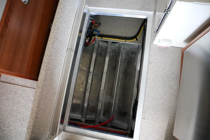 Slide: The Image of Hewescraft 290 Adventure ET HT 2025 interior compartment with visible wiring and metal structure. - 40