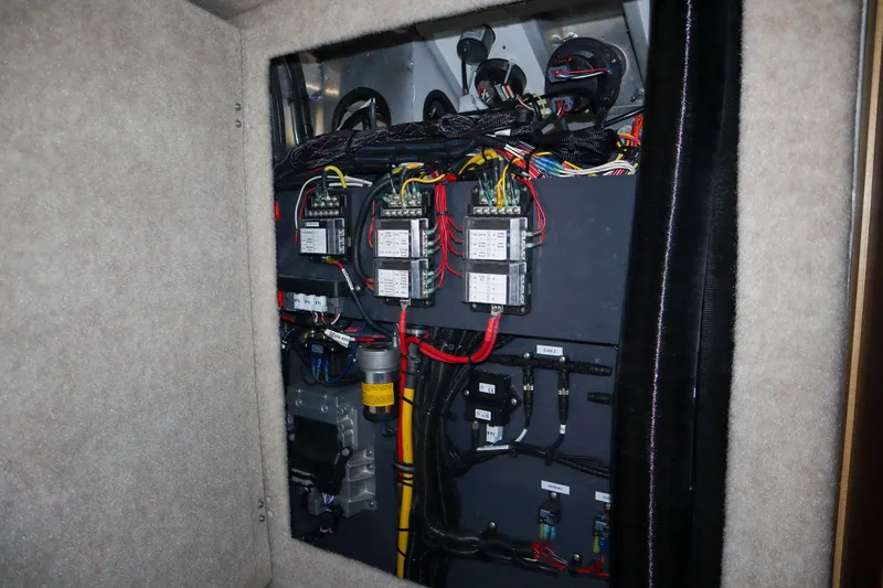 Slide: The Image of Electrical panel of 2025 Hewescraft 290 Adventure ET HT boat, showcasing wiring and components. - 45