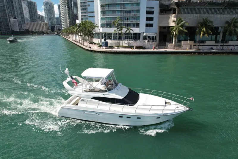 Slide: The Image of Azimut 43 yacht cruising in a city waterway, 1997 model. - 14