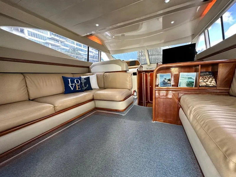 Slide: The Image of Luxurious interior of a 1997 Azimut 43 yacht with beige leather seating. - 20