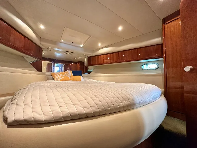 Slide: The Image of Luxurious cabin interior of a 1997 Azimut 43 yacht with cozy bedding. - 24