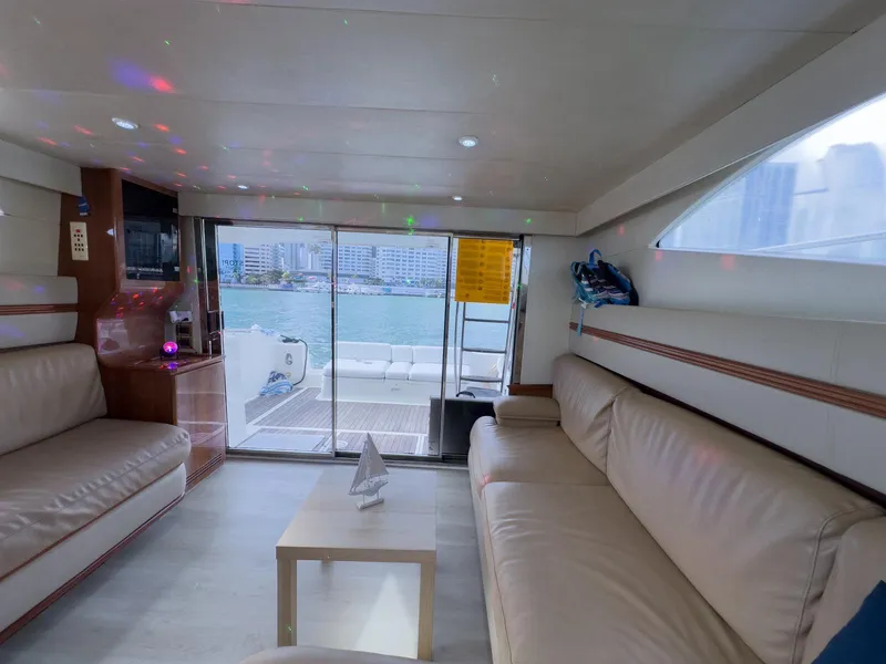 Slide: The Image of Luxurious interior of a 1997 Azimut 43 yacht with waterfront view. - 30
