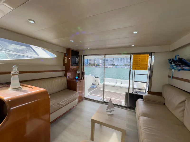 Slide: The Image of Luxurious interior of a 1997 Azimut 43 yacht with leather seating and waterfront view. - 31