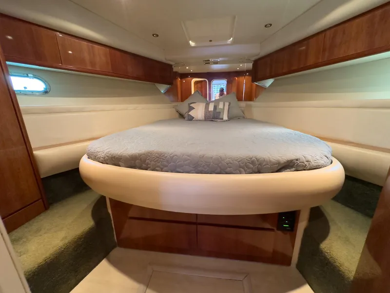 Slide: The Image of Luxurious cabin interior of a 1997 Azimut 43 yacht with a round bed. - 35