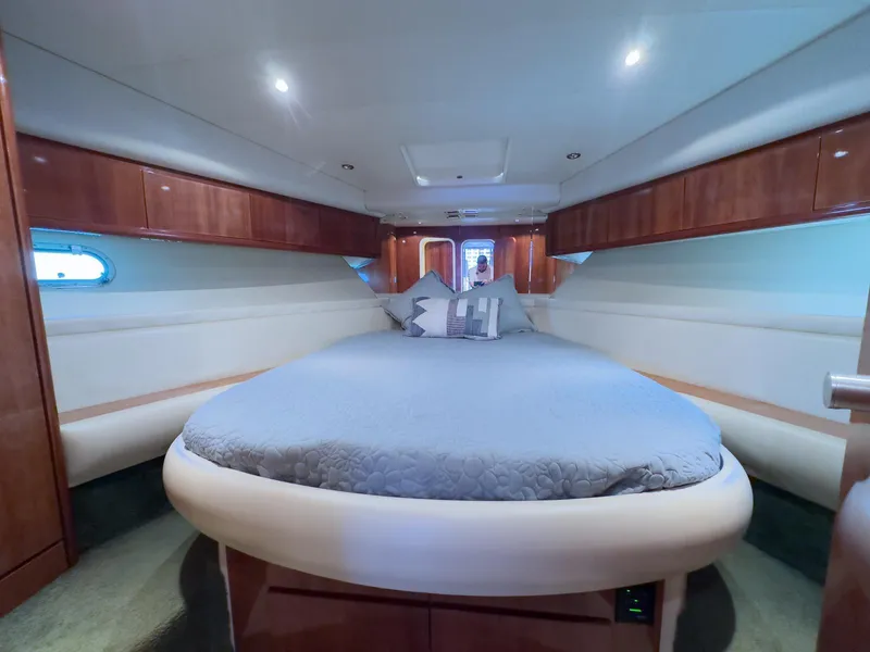 Slide: The Image of Luxurious cabin interior of a 1997 Azimut 43 yacht with elegant wood finishes. - 41
