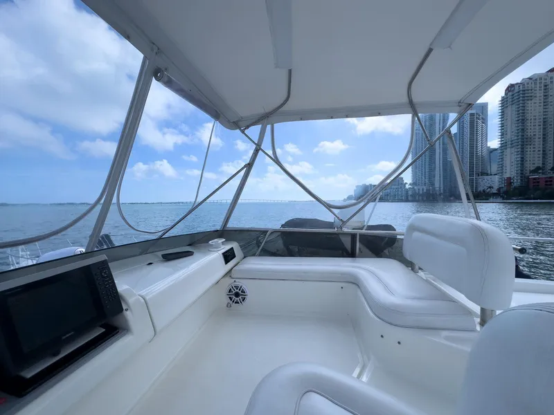 Slide: The Image of Interior view of 1997 Azimut 43 yacht with city skyline and ocean backdrop. - 42