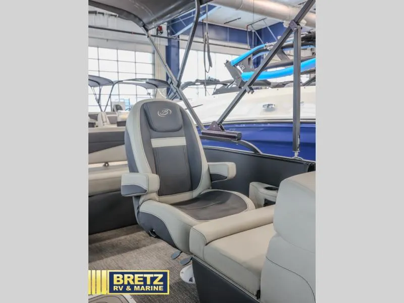 Slide: The Image of 2023 Cabrio 24UC boat interior with comfortable seating at Bretz RV & Marine showroom. - 13