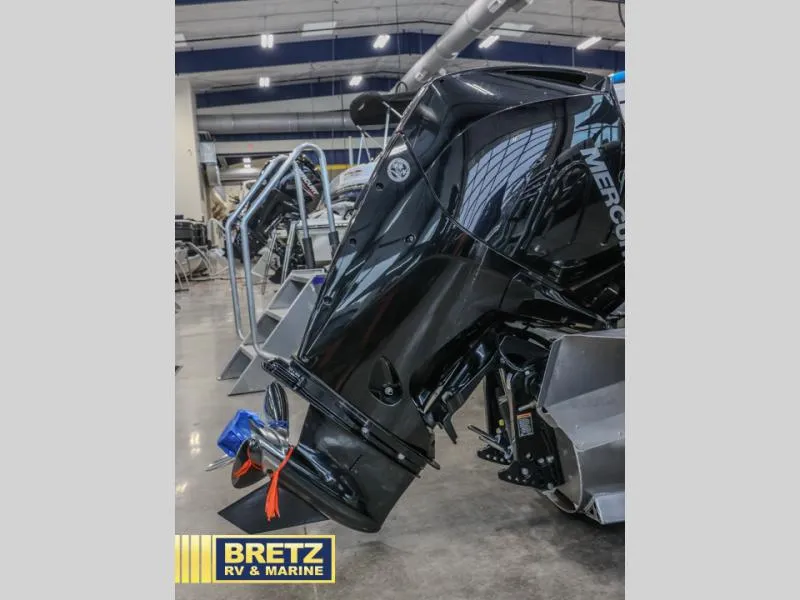 Slide: The Image of 2023 Cabrio 24UC boat motor displayed at Bretz RV & Marine showroom. - 7