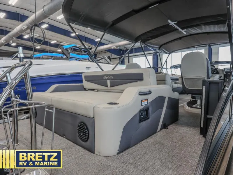 Slide: The Image of 2023 Cabrio 24UC boat interior with seating, showcased at Bretz RV & Marine. - 8