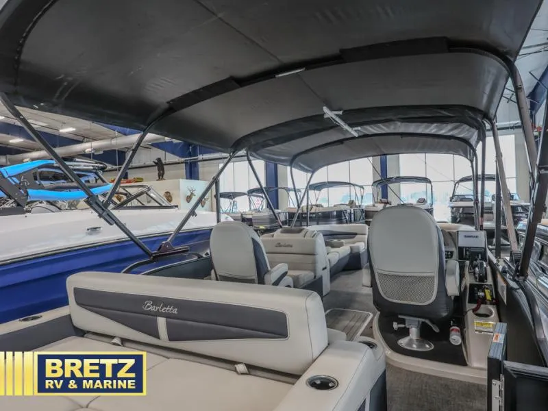 Slide: The Image of 2023 Cabrio 24UC boat interior at Bretz RV & Marine showroom. - 9