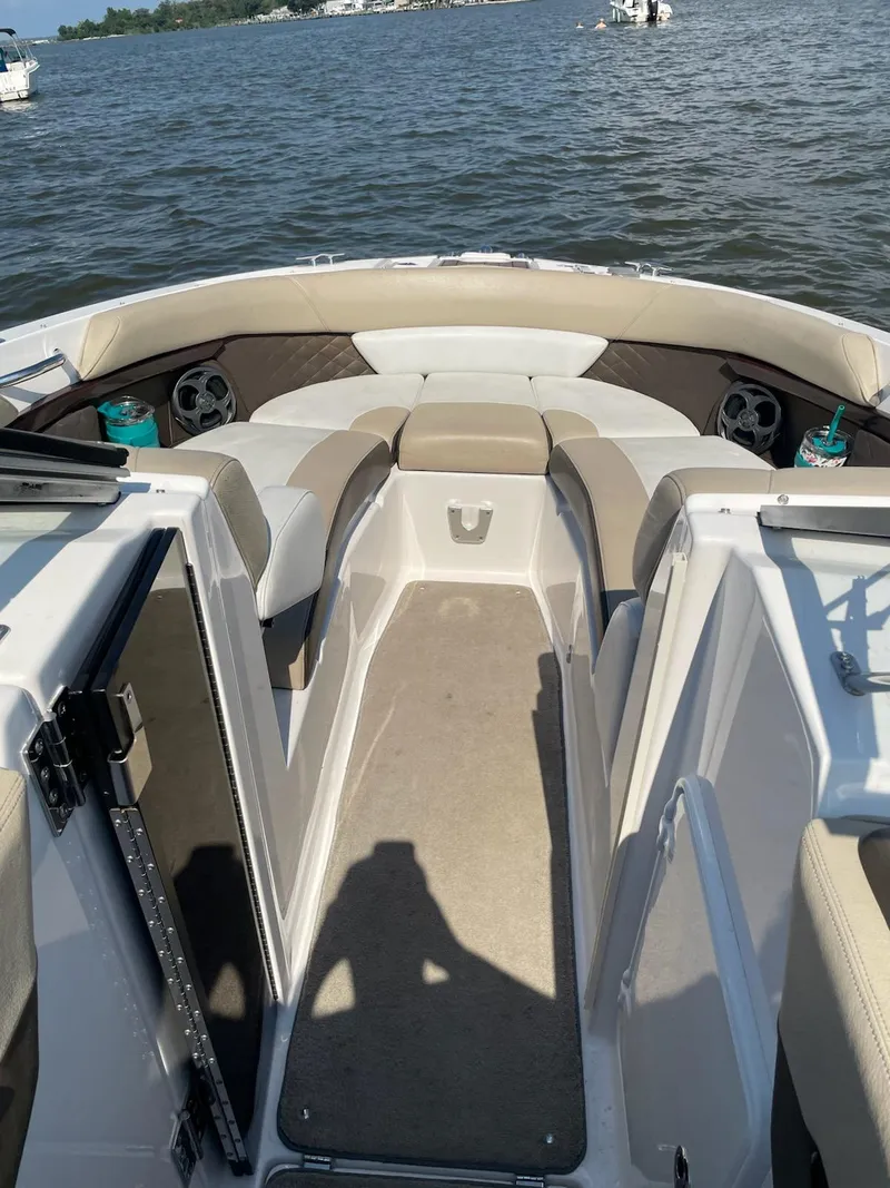 Slide: The Image of 2013 Regal 2700 ES Bowrider on water, featuring spacious seating and elegant design. - 3