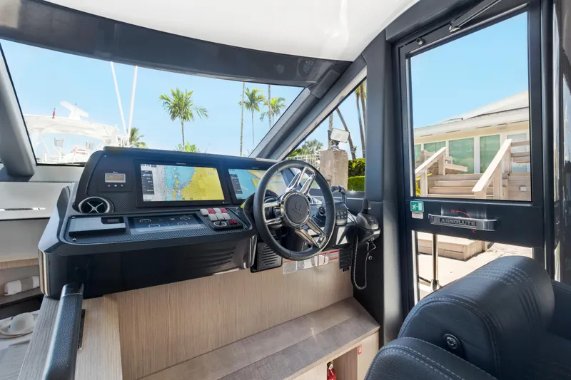 Slide: The Image of Interior helm of 2022 Absolute 48 Coupe yacht with modern navigation equipment. - 22