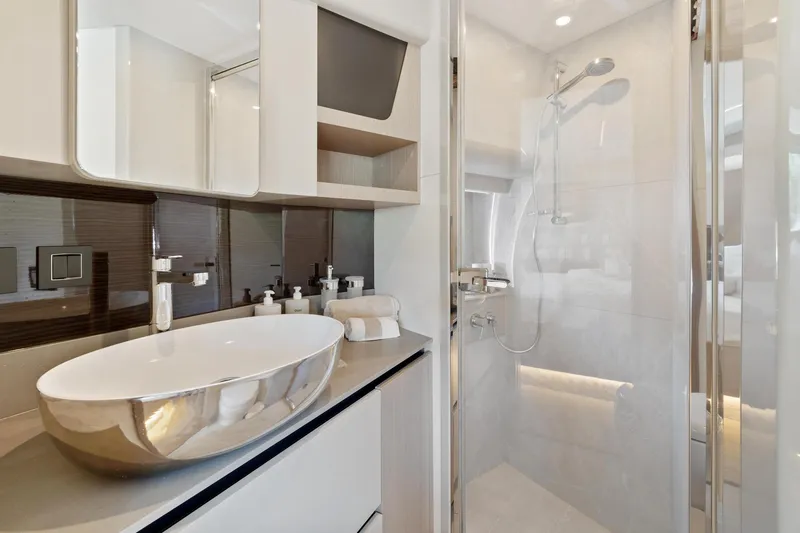 Slide: The Image of Luxurious bathroom in 2022 Absolute 48 Coupe yacht with modern fixtures and elegant design. - 34