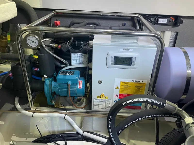 Slide: The Image of Engine room of 2022 Absolute 48 Coupe with mechanical equipment and control panel. - 37