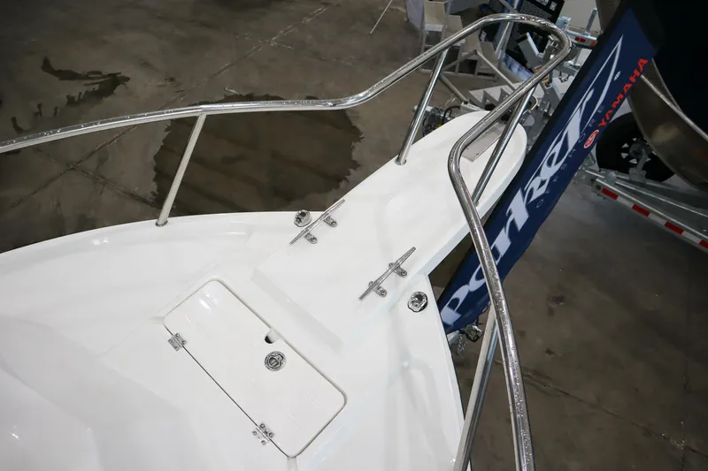 Slide: The Image of 2025 Parker 2120 Sport Cabin boat deck with stainless steel railings. - 18