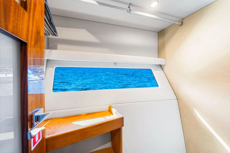 Slide: The Image of Interior view of 2022 Riviera 505 SUV yacht with ocean view window. - 14