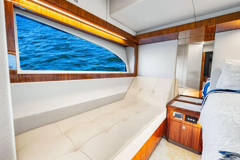 Slide: The Image of Luxurious interior of 2022 Riviera 505 SUV yacht with ocean view window. - 18