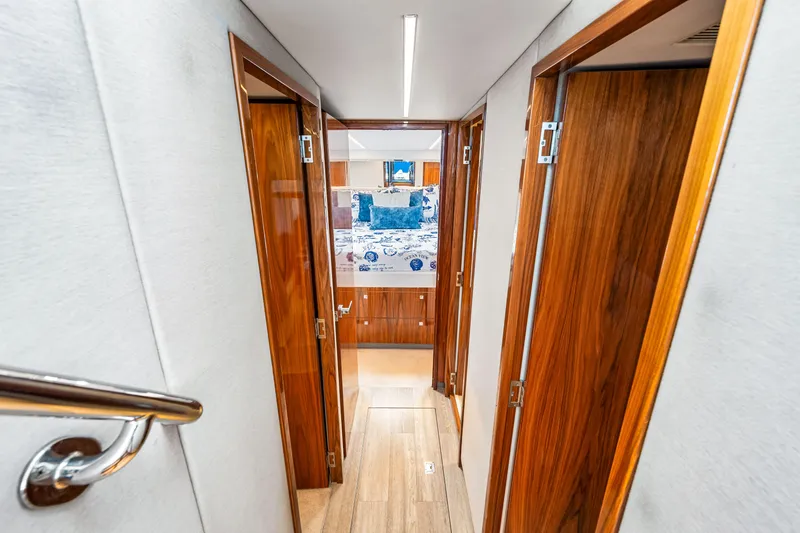 Slide: The Image of 2022 Riviera 505 SUV interior hallway with wooden doors and modern design. - 23